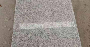 营口芝麻白光面毛板