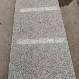 营口芝麻白光面毛板